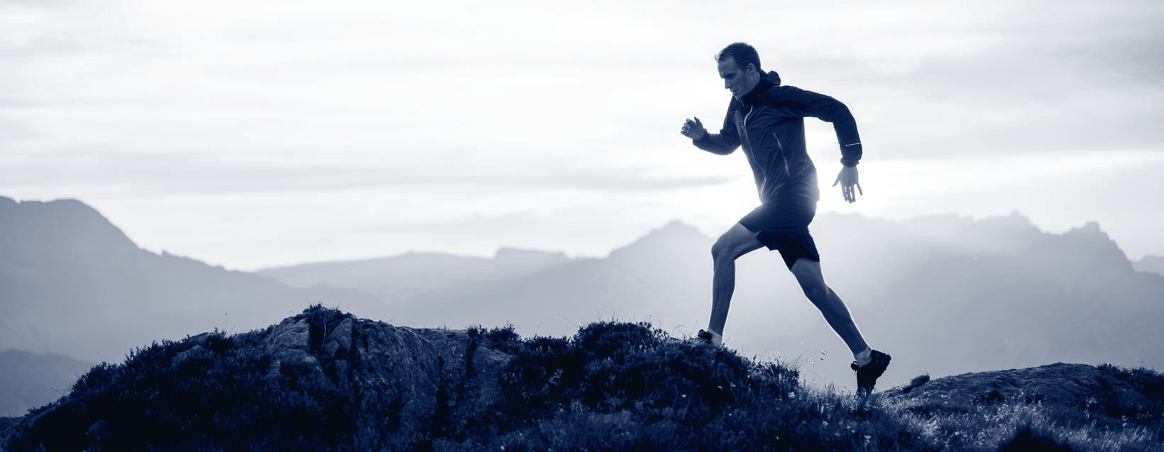 Man running through the mountains