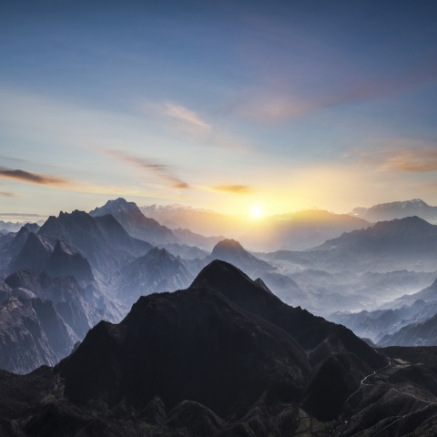 Sunrise behind a mountain range