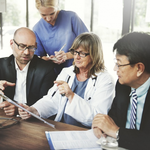 Group of healthcare workers having a discussion with each other